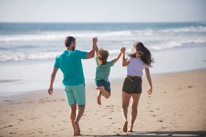 Picture of a family walking on the beach.